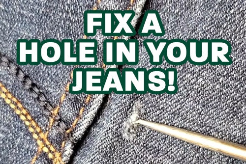 showing a hole in a pair of denim jeans