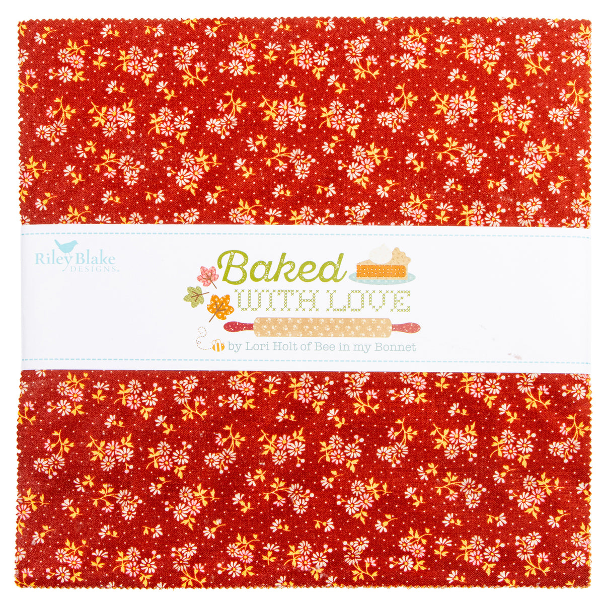 A folded fabric bundle with a red background and a white center band printed with the text 'Baked WITH LOVE' and 'by Lori Hall of Bew in my Beecher.' The fabric has a repeating floral and leaf pattern in yellow, orange, and white.
