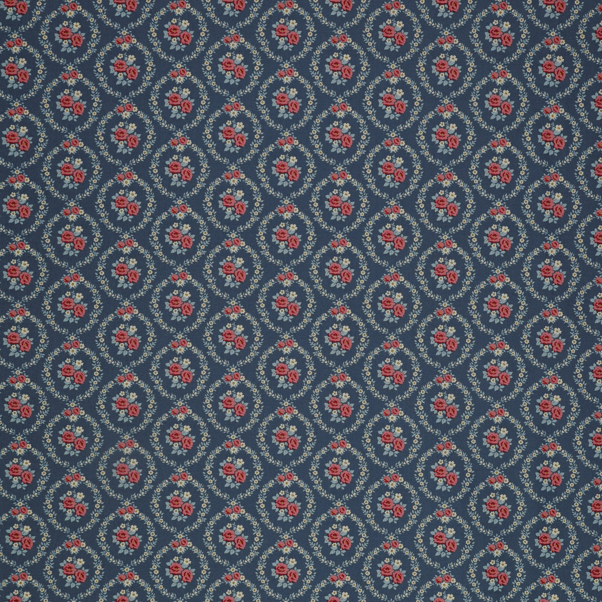 Village Life Fabric Collection - Mable Blue: Blue with pink rose bouquets framed by cream floral wreaths in a repeating pattern TIL100697-MABLE-BLUE
