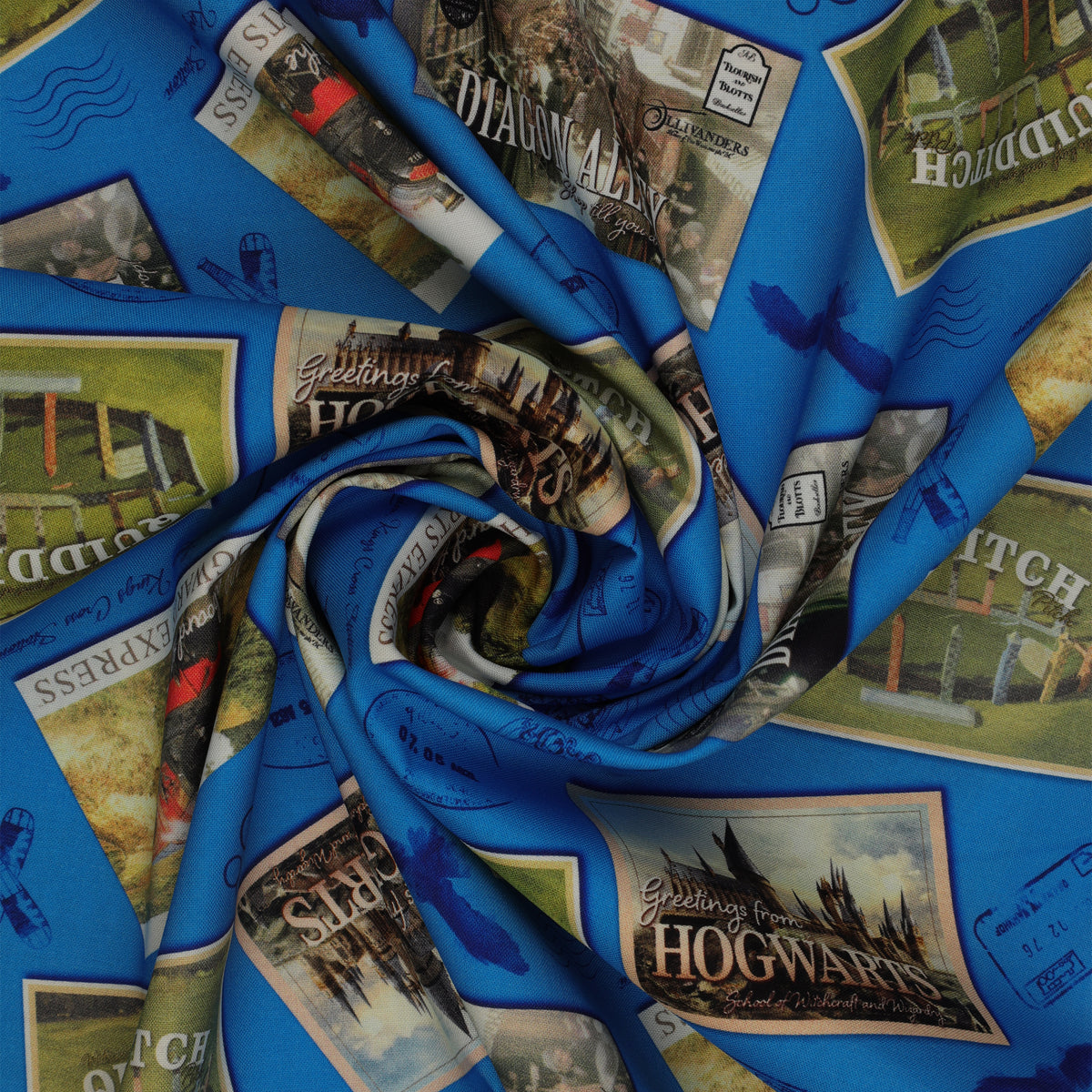 Royal-blue fabric with Hogwarts, Hogwarts Express, Diagon Alley and Quidditch postcards, plus postal marks in a swirl.