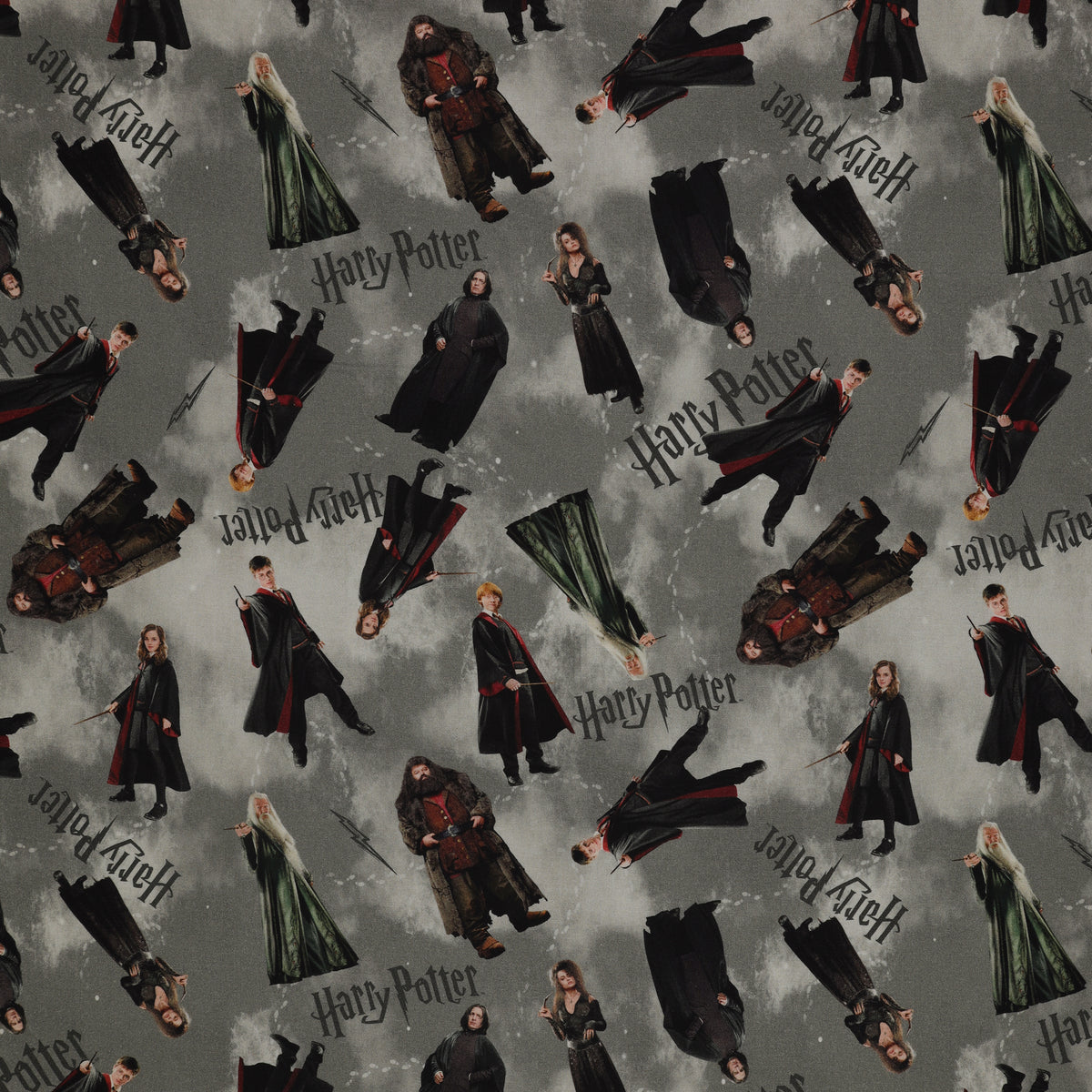 Gray Harry Potter fabric with scattered robed film figures, black logos, lightning bolts and pale footprints.