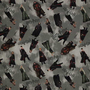 Gray Harry Potter fabric with scattered robed film figures, black logos, lightning bolts and pale footprints.