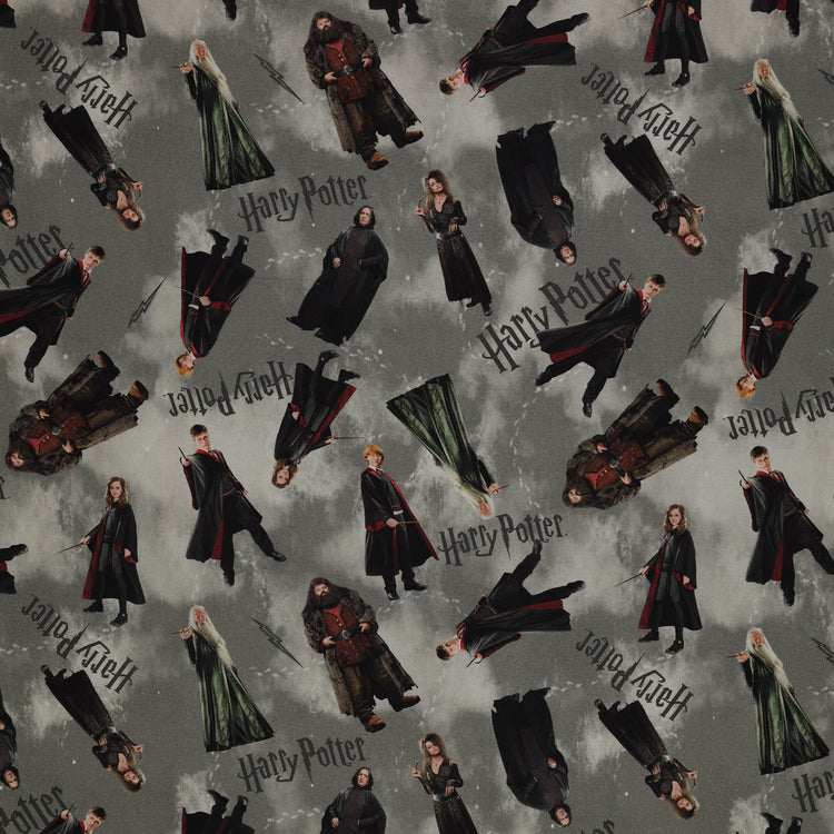 Gray Harry Potter fabric with scattered robed film figures, black logos, lightning bolts and pale footprints.