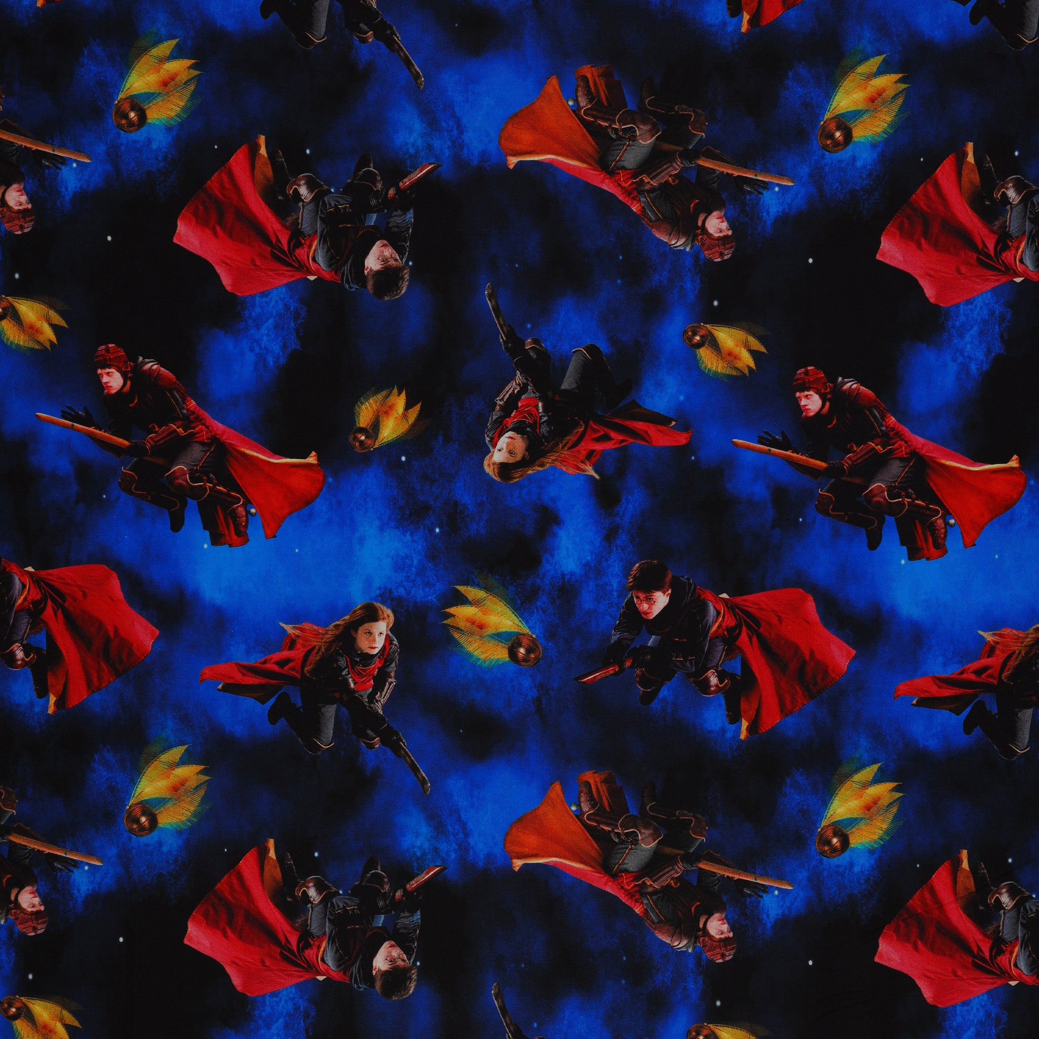 Red-caped broomstick riders and Golden Snitches on an electric-blue and black Harry Potter fabric background.
