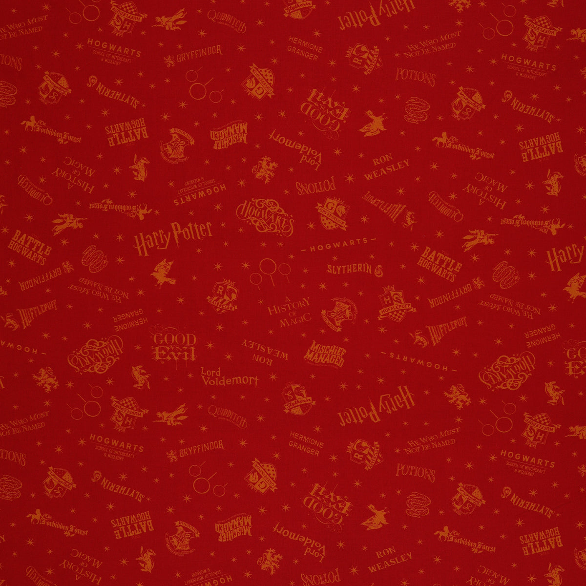 Red Harry Potter fabric with golden-yellow lettering, Hogwarts house shields and scattered stars.