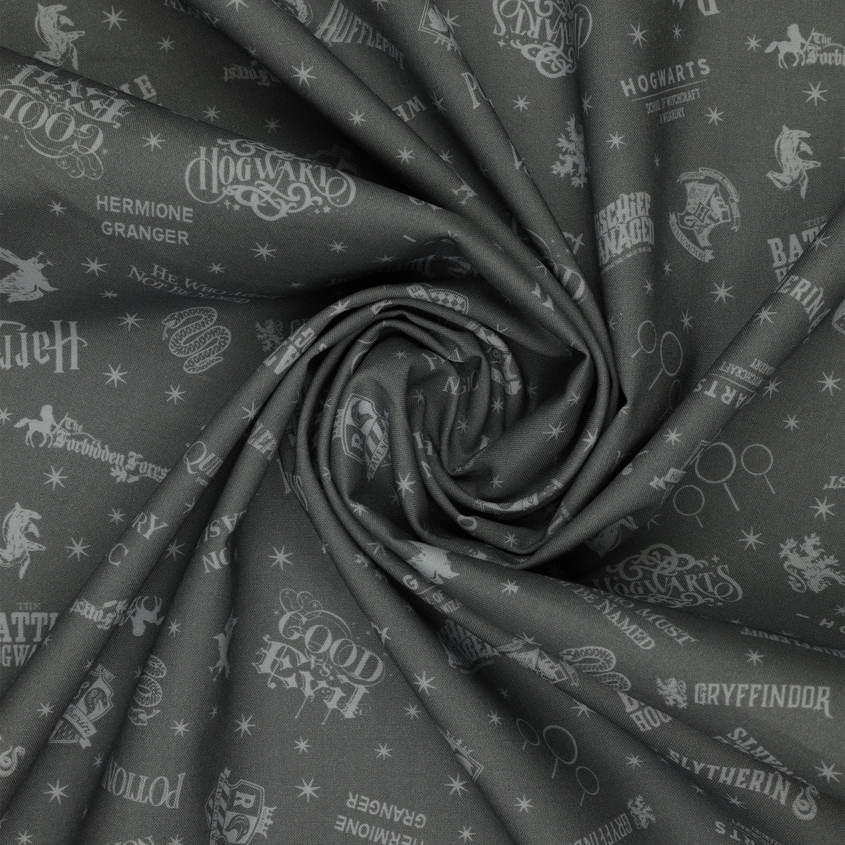 Charcoal Harry Potter fabric with pale gray words, house crests, Quidditch goalposts and stars in a swirl.