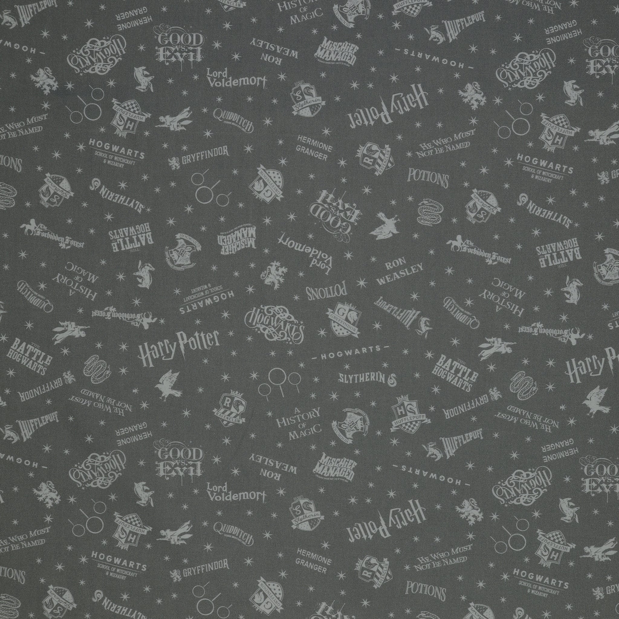 Charcoal Harry Potter fabric with pale gray words, house crests, Quidditch goalposts and stars.