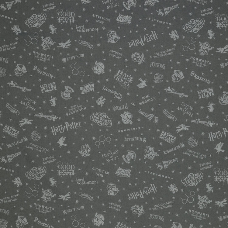 Charcoal Harry Potter fabric with pale gray words, house crests, Quidditch goalposts and stars.
