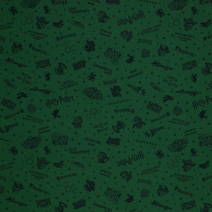 Dark green Harry Potter fabric with nearly black house crests, serpents, words and scattered stars.