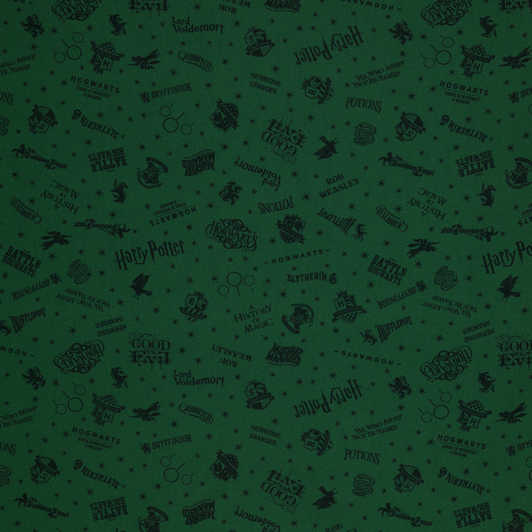 Dark green Harry Potter fabric with nearly black house crests, serpents, words and scattered stars.