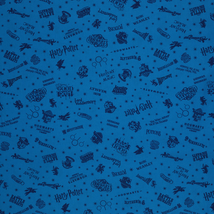 Blue Harry Potter fabric with navy lettering, house badges, Quidditch goalposts and small stars.