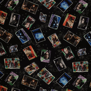 Black Harry Potter fabric with colorful framed film portraits, gray stars and swirling flourishes.