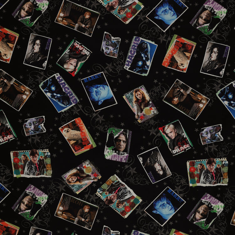 Black Harry Potter fabric with colorful framed film portraits, gray stars and swirling flourishes.