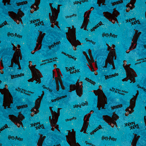 Turquoise Harry Potter fabric with robed figures, black spell lettering and scattered stars over blue swirls.