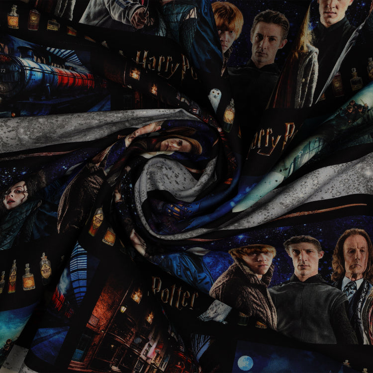 Harry Potter fabric with horizontal bands of film portraits, wands, potion bottles and scenes in blue, black and gray in a swirl.