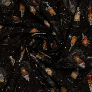 Black Harry Potter fabric with scattered potion bottles, antique-style labels, gray swirls and white stars in a swirl.