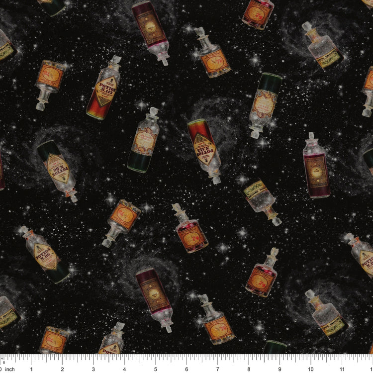 Black Harry Potter fabric with scattered potion bottles, antique-style labels, gray swirls and white stars with ruler for scale.