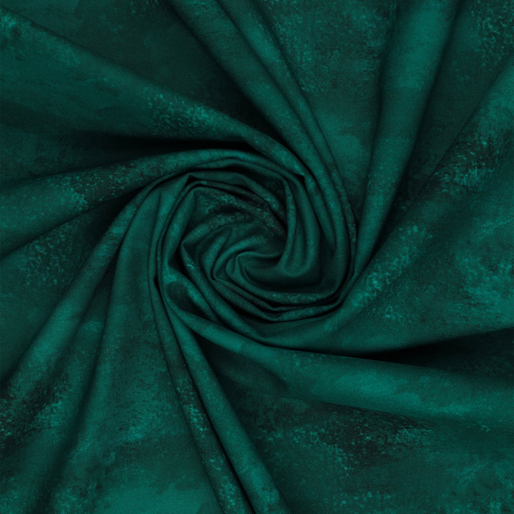 Teal mottled fabric from Benartex Bushel & Bloom Terra Nova collection, shown swirled to display texture