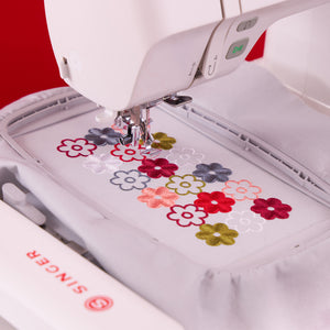 Close up of Singer embroidery hoop with floral embroidery. 