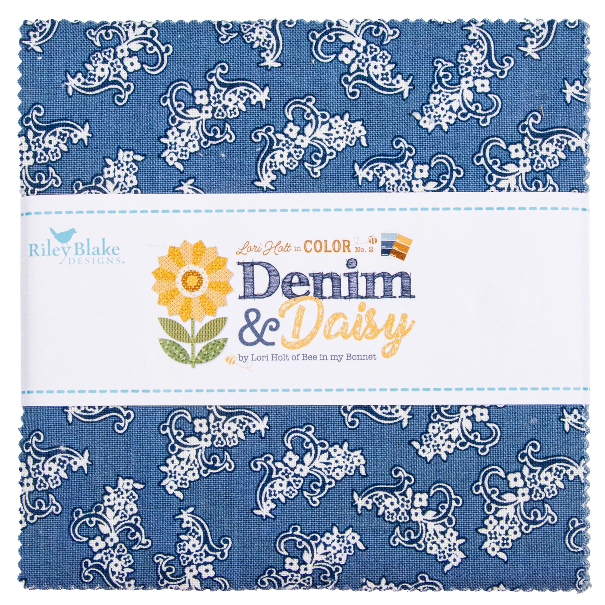 A folded fabric bundle with a blue and white floral paisley pattern, wrapped in a white paper band labeled Riley Blake Designs Denim & Daisy.