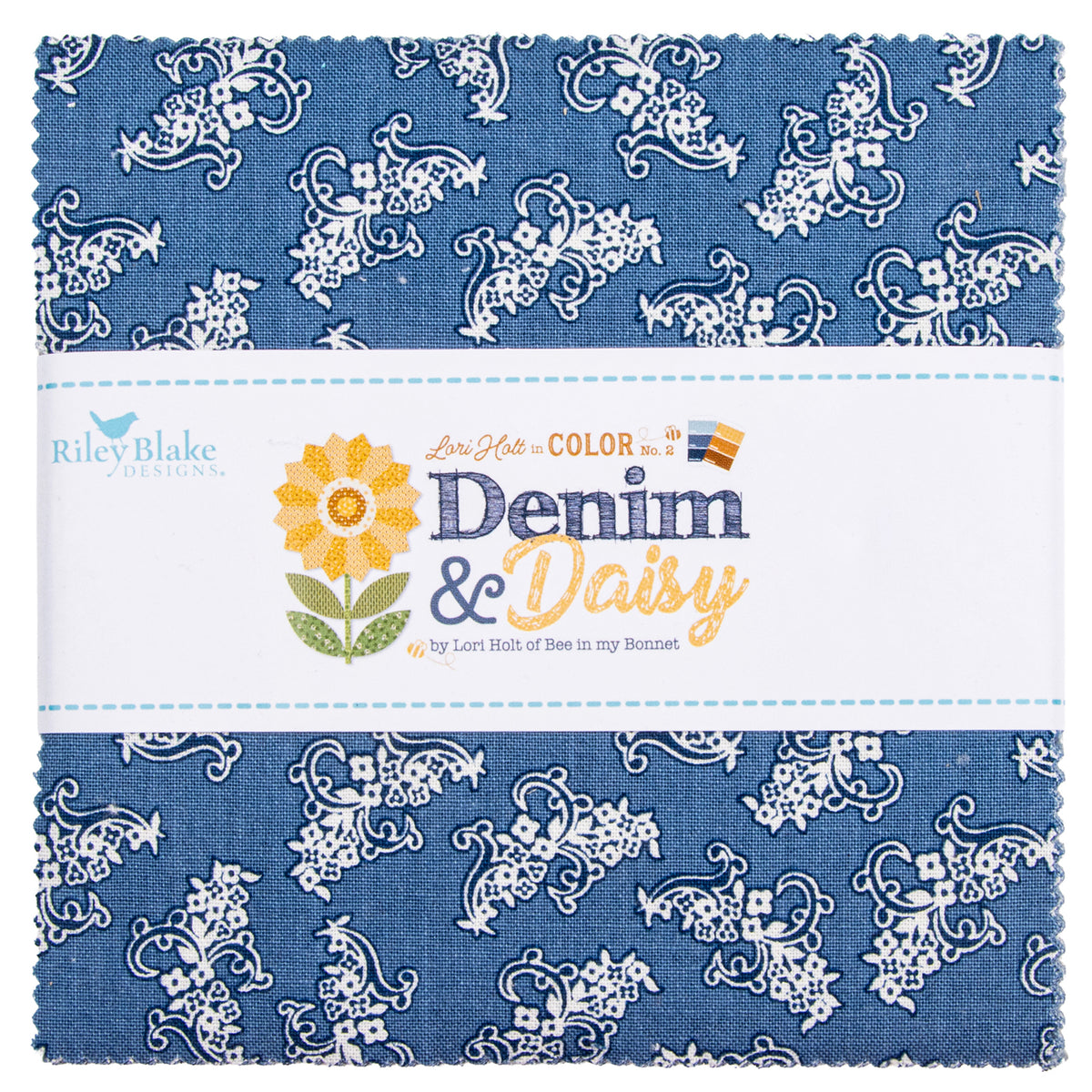 A folded fabric bundle with a blue and white floral paisley pattern, wrapped in a white paper band labeled Riley Blake Designs Denim & Daisy.