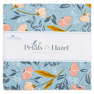 Close-up of Petals & Hazel 5-inch Stacker with blue floral fabric and a white Riley Blake Designs label.
