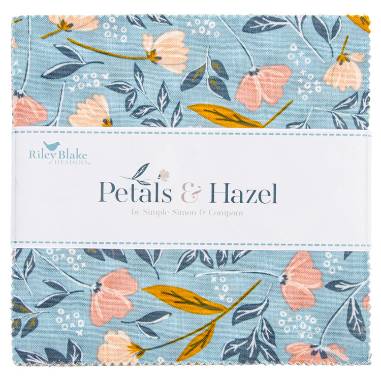 Close-up of Petals & Hazel 5-inch Stacker with blue floral fabric and a white Riley Blake Designs label.