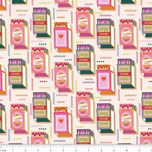 Cream fabric with rows of retro matchbooks and colorful zigzag accents, shown with ruler for scale