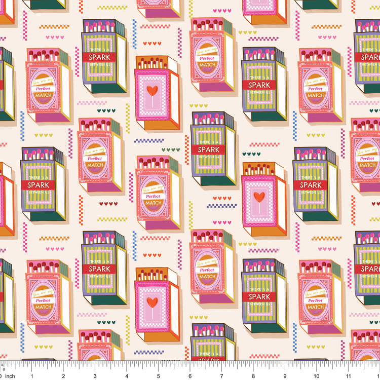 Cream fabric with rows of retro matchbooks and colorful zigzag accents, shown with ruler for scale