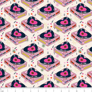 Cream fabric with pink turntables playing heart-shaped records, shown with ruler for scale
