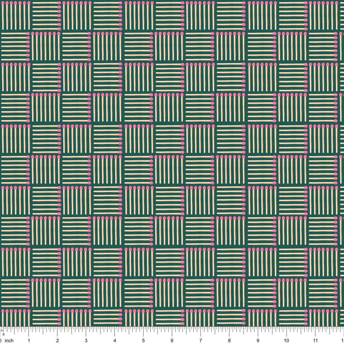 Dark green fabric with pink-tipped matchsticks in a basketweave, shown with ruler for scale