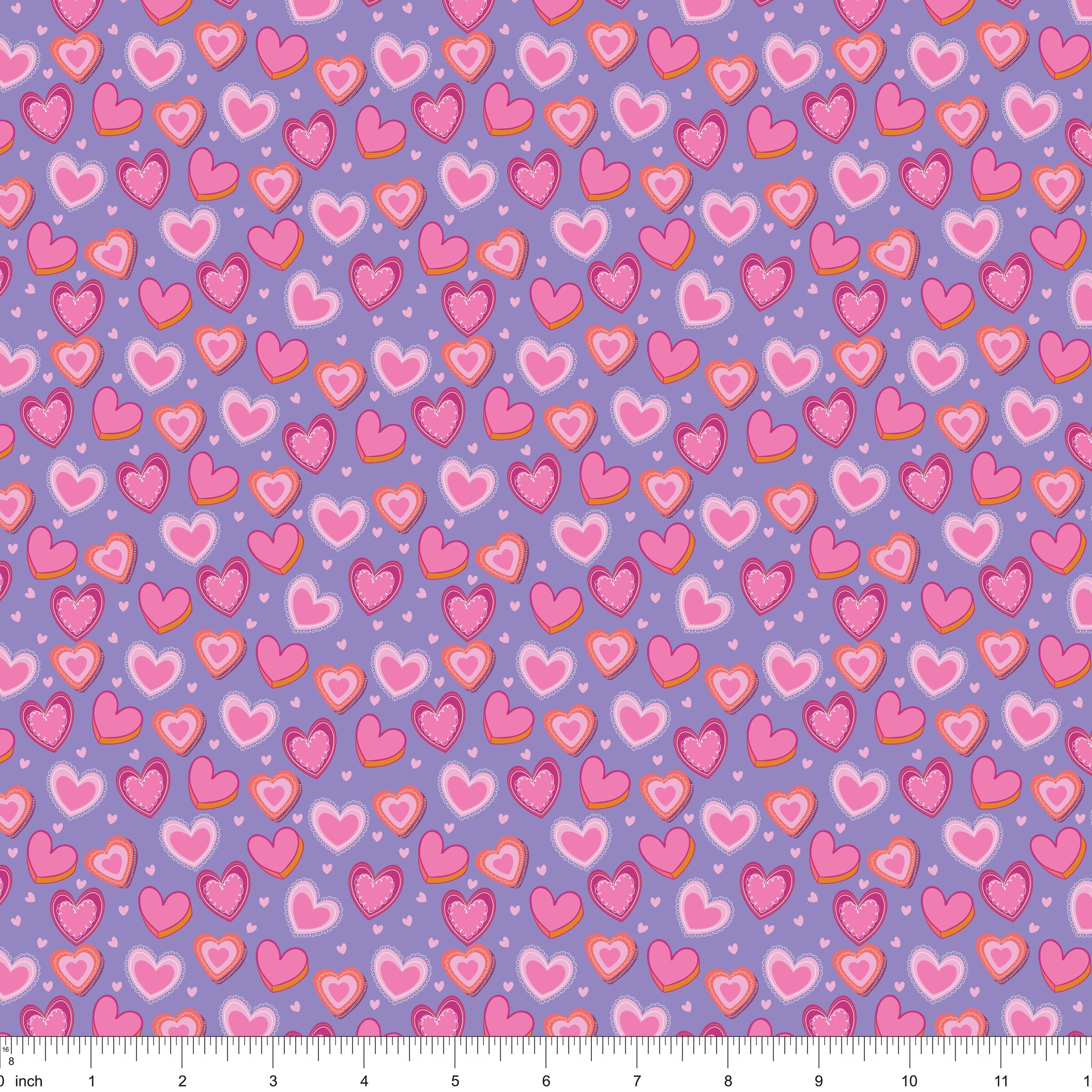 Lavender fabric with layered pink hearts, shown with ruler for scale