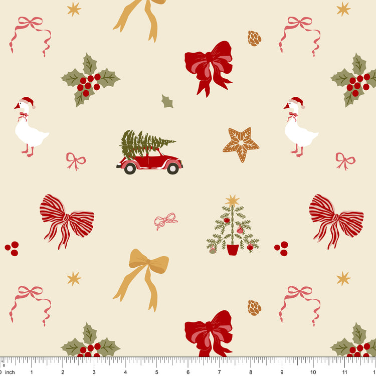 Cream fabric with tossed red and striped bows, gold bows, holly, a goose in a Santa hat, a red car with a tree and a gingerbread star, shown with ruler for scale