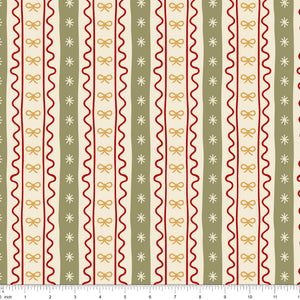 Cream fabric with vertical stripes of red ric rac, gold bows and sage bands with stars, shown with ruler for scale