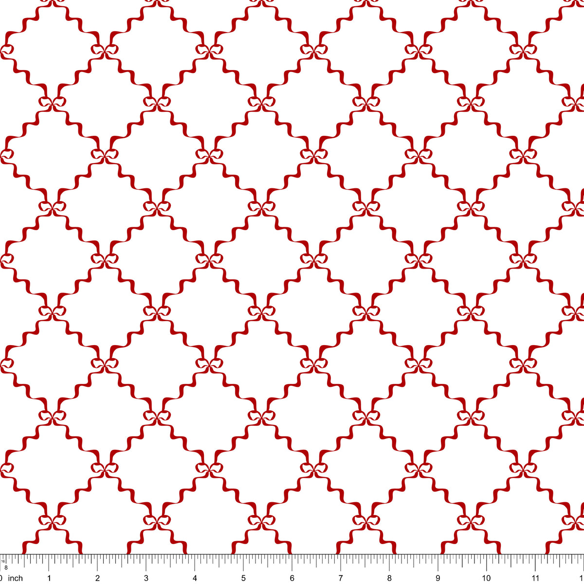 White fabric with a red ribbon lattice tied with small bows, shown with ruler for scale