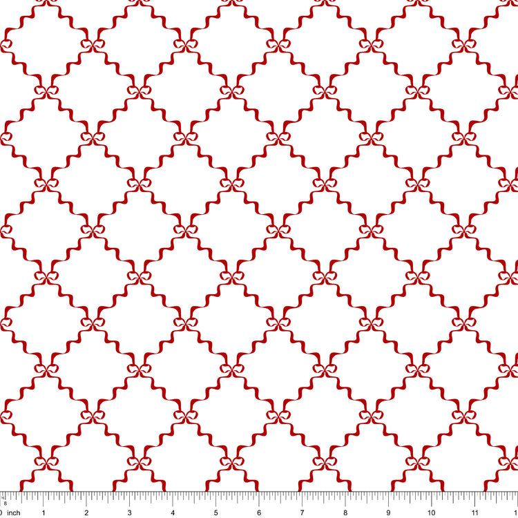 White fabric with a red ribbon lattice tied with small bows, shown with ruler for scale