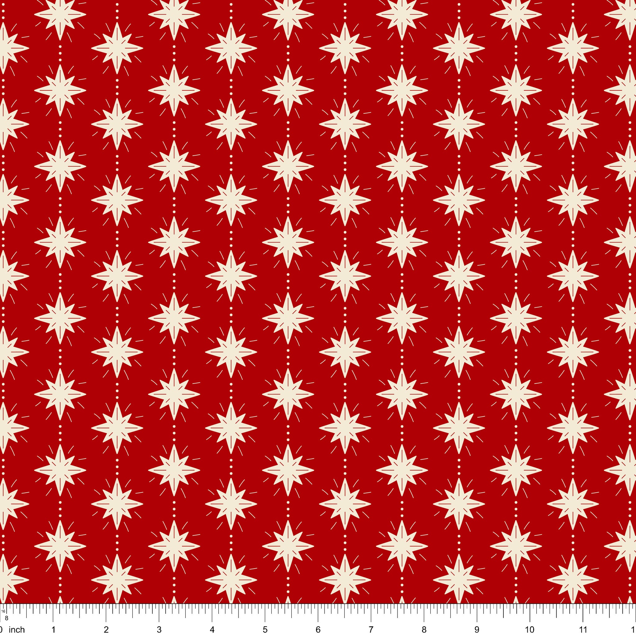 Cranberry red fabric with cream eight-point stars, shown with ruler for scale