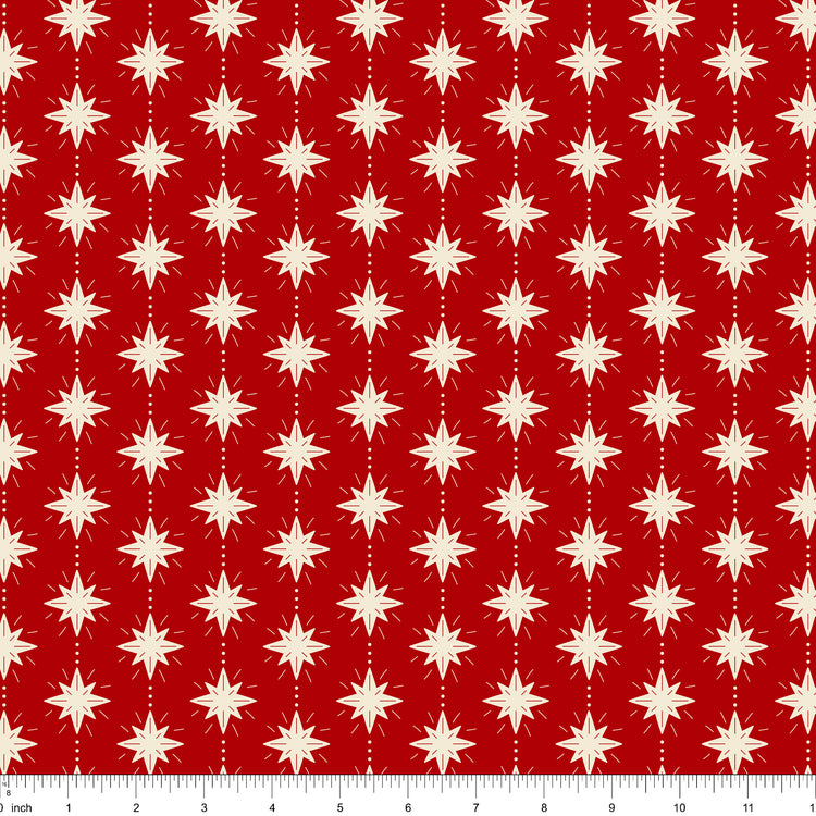 Cranberry red fabric with cream eight-point stars, shown with ruler for scale