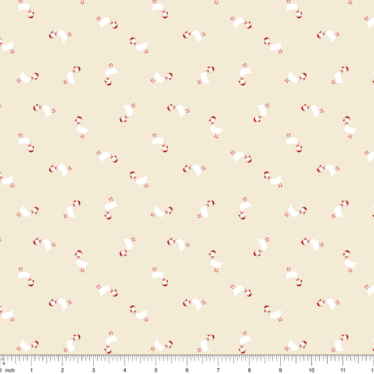 Cream fabric with small white geese in Santa hats and red bows tossed in every direction, shown with ruler for scale