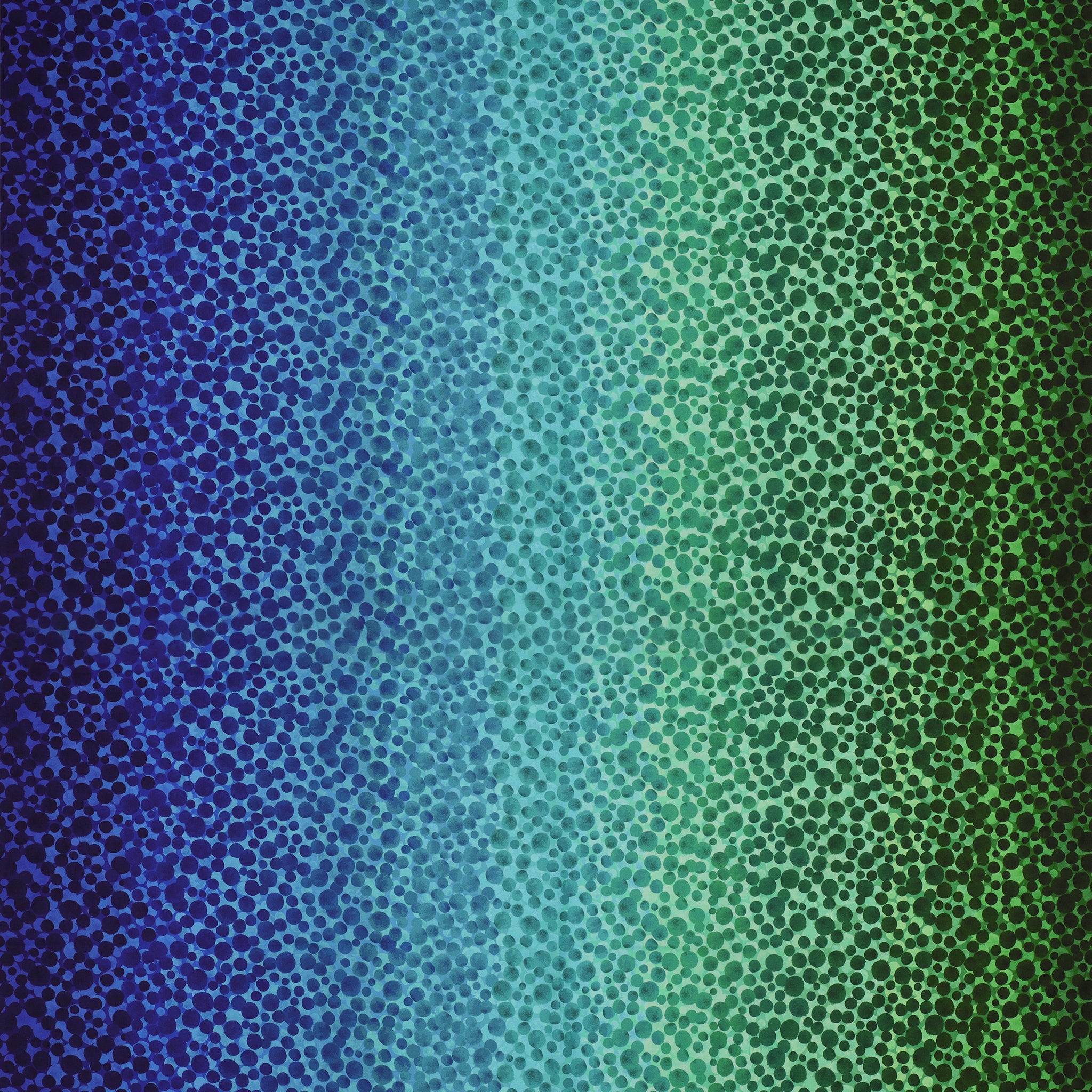 Bumbleberries Ocean fabric featuring densely scattered watercolor-style dots transitioning from deep navy and royal blue to turquoise, teal, and rich green.