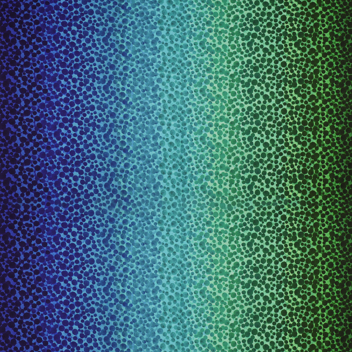 Bumbleberries Ocean fabric featuring densely scattered watercolor-style dots transitioning from deep navy and royal blue to turquoise, teal, and rich green.