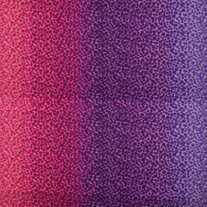 Bumbleberries Pinky Purple fabric featuring densely scattered watercolor-style dots transitioning from bright pink and magenta to deep purple and lavender.