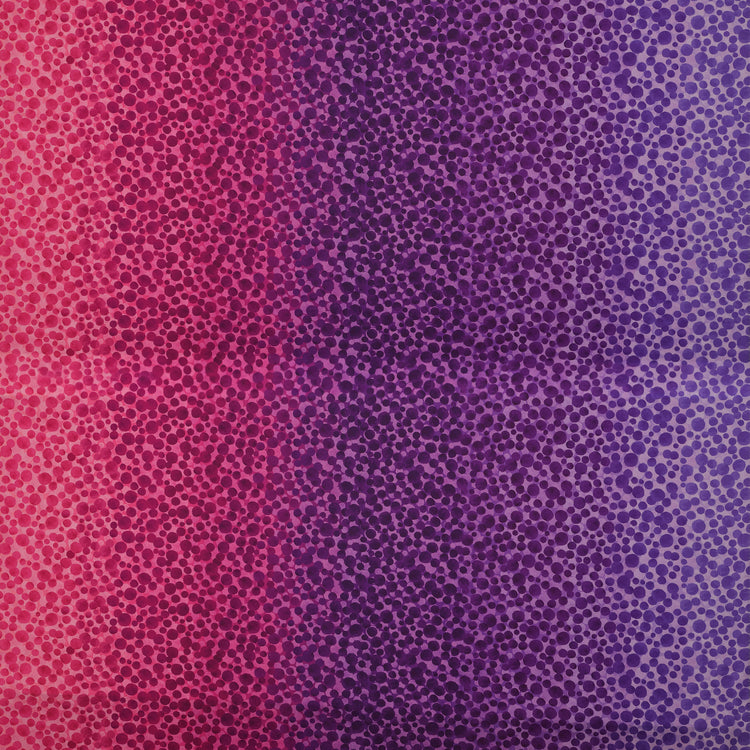 Bumbleberries Pinky Purple fabric featuring densely scattered watercolor-style dots transitioning from bright pink and magenta to deep purple and lavender.