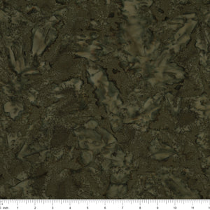 A close-up of a dark olive green and brown textured pattern with a ruler scale at the bottom indicating inches.