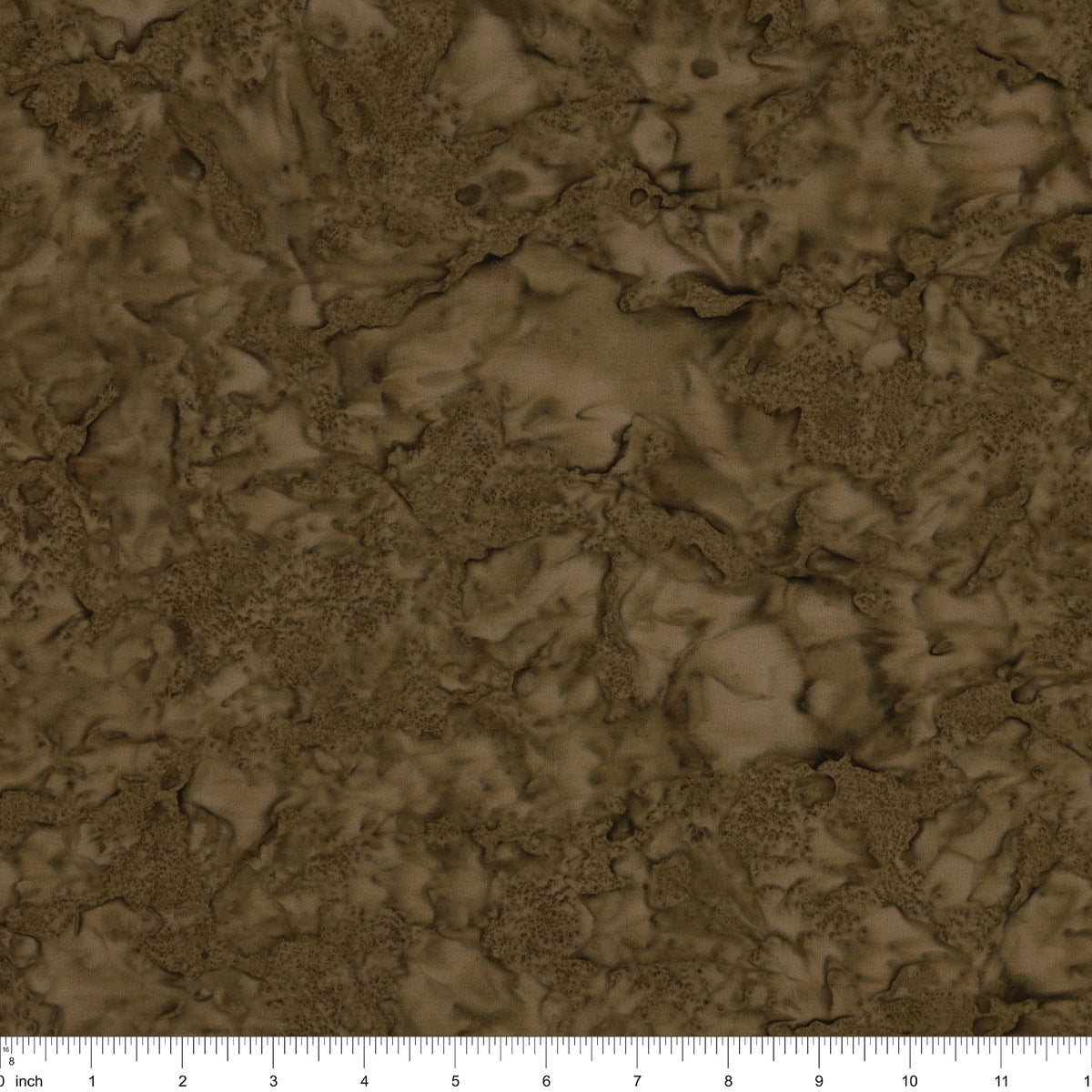 Brown marbled fabric texture with a ruler scale at the bottom indicating inches.