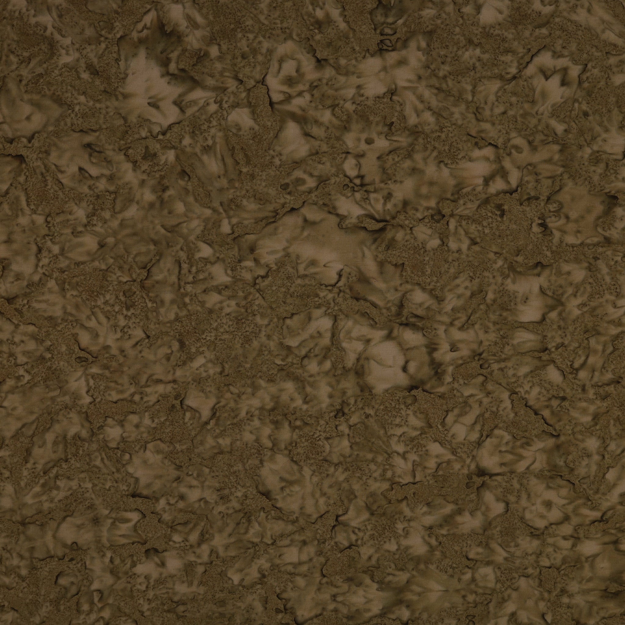 A close-up of a textured brown surface with organic, cracked, or marbled patterns in varying shades of earthy brown and tan.