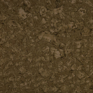 A close-up of a textured brown surface with organic, cracked, or marbled patterns in varying shades of earthy brown and tan.