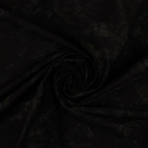Black fabric with a subtle tonal pattern, styled in a central spiral swirl to show its drape and texture.