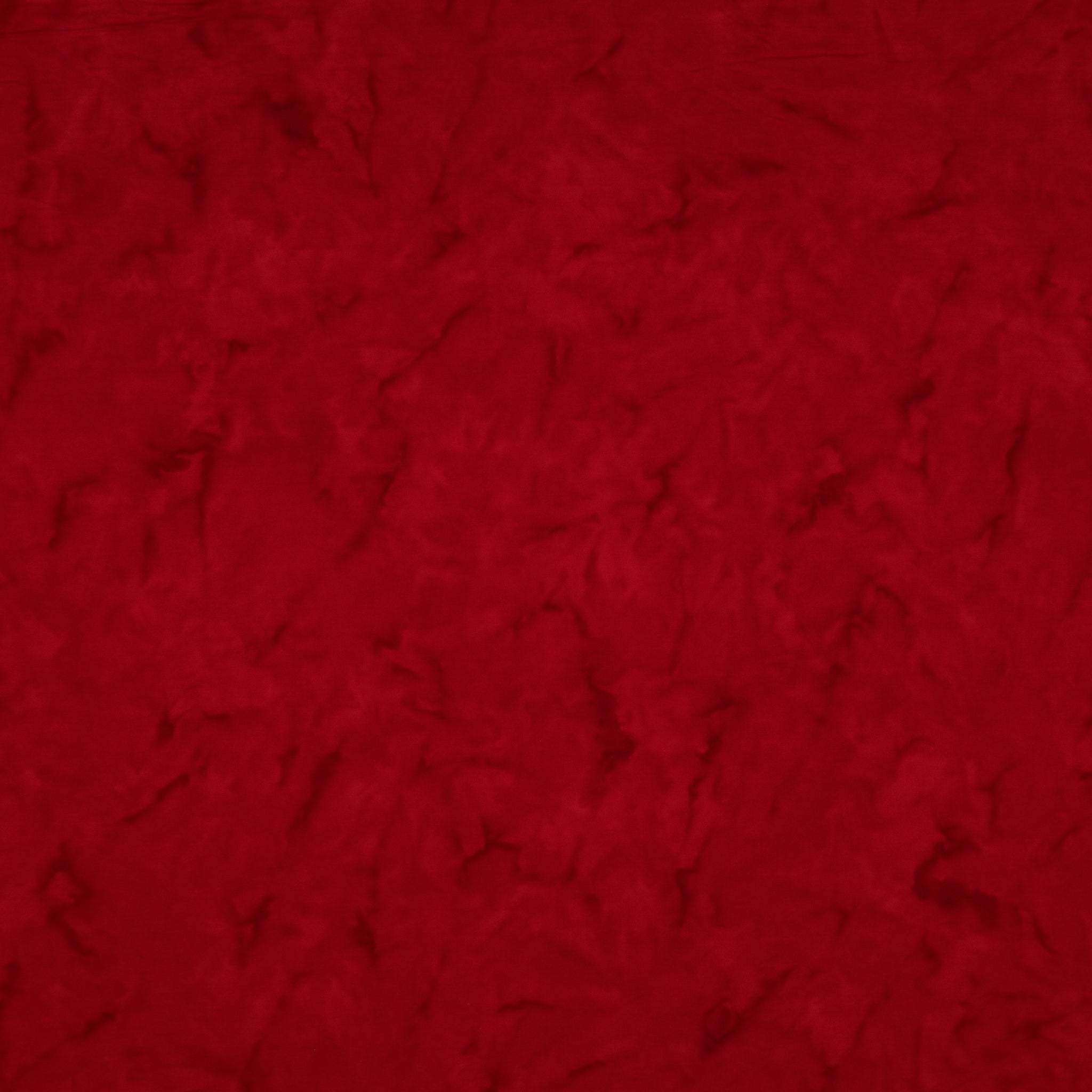 A close-up of a textured red fabric filling the entire frame.