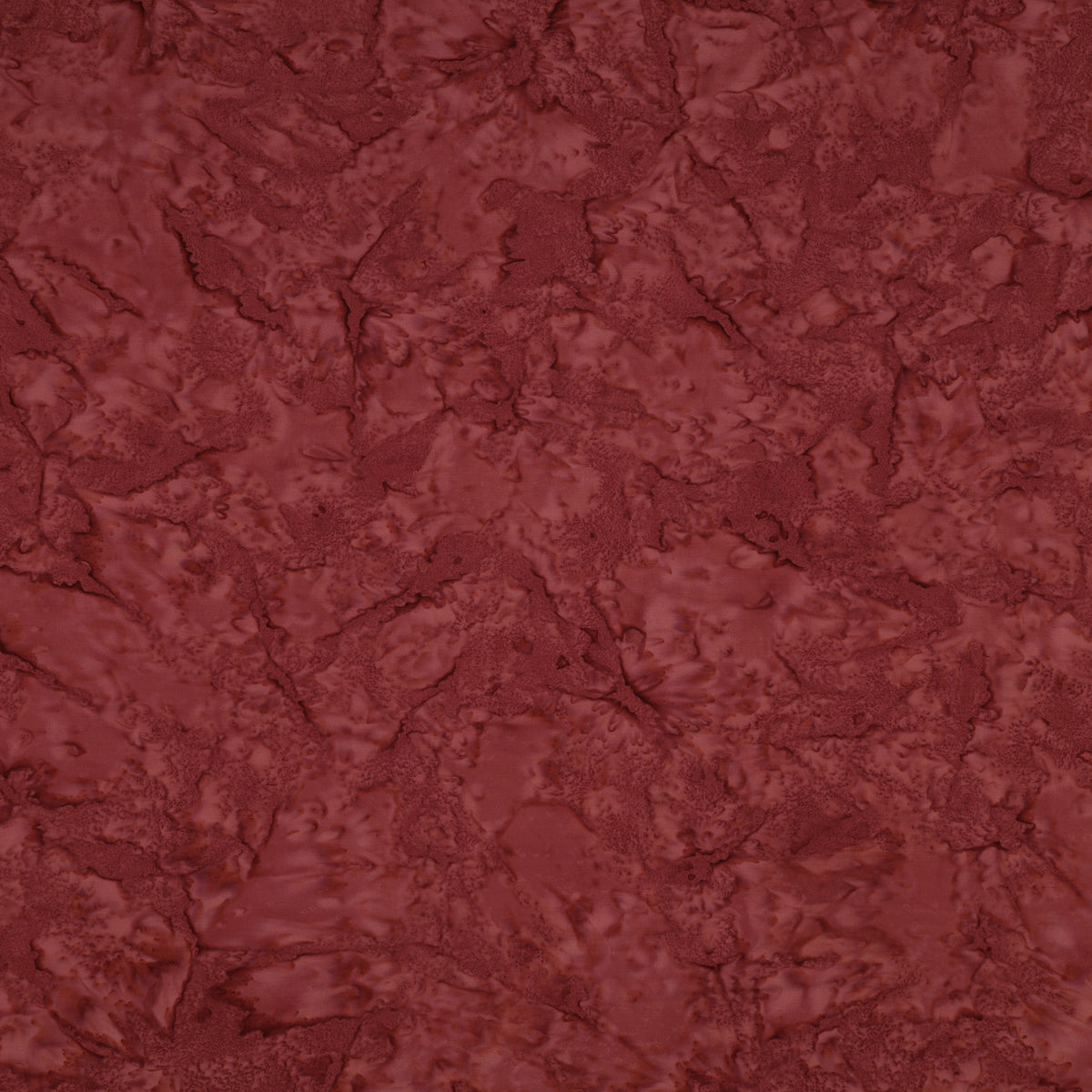 A close-up of a textured, marbled surface in a deep reddish-brown or burgundy tone, filling the entire frame.